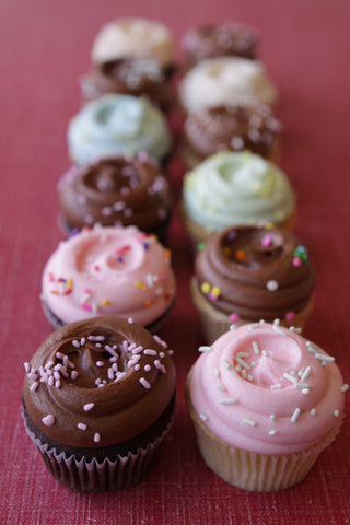 Assorted Traditional Cupcakes with assorted pastel buttercream frostings and chocolate buttercream. 