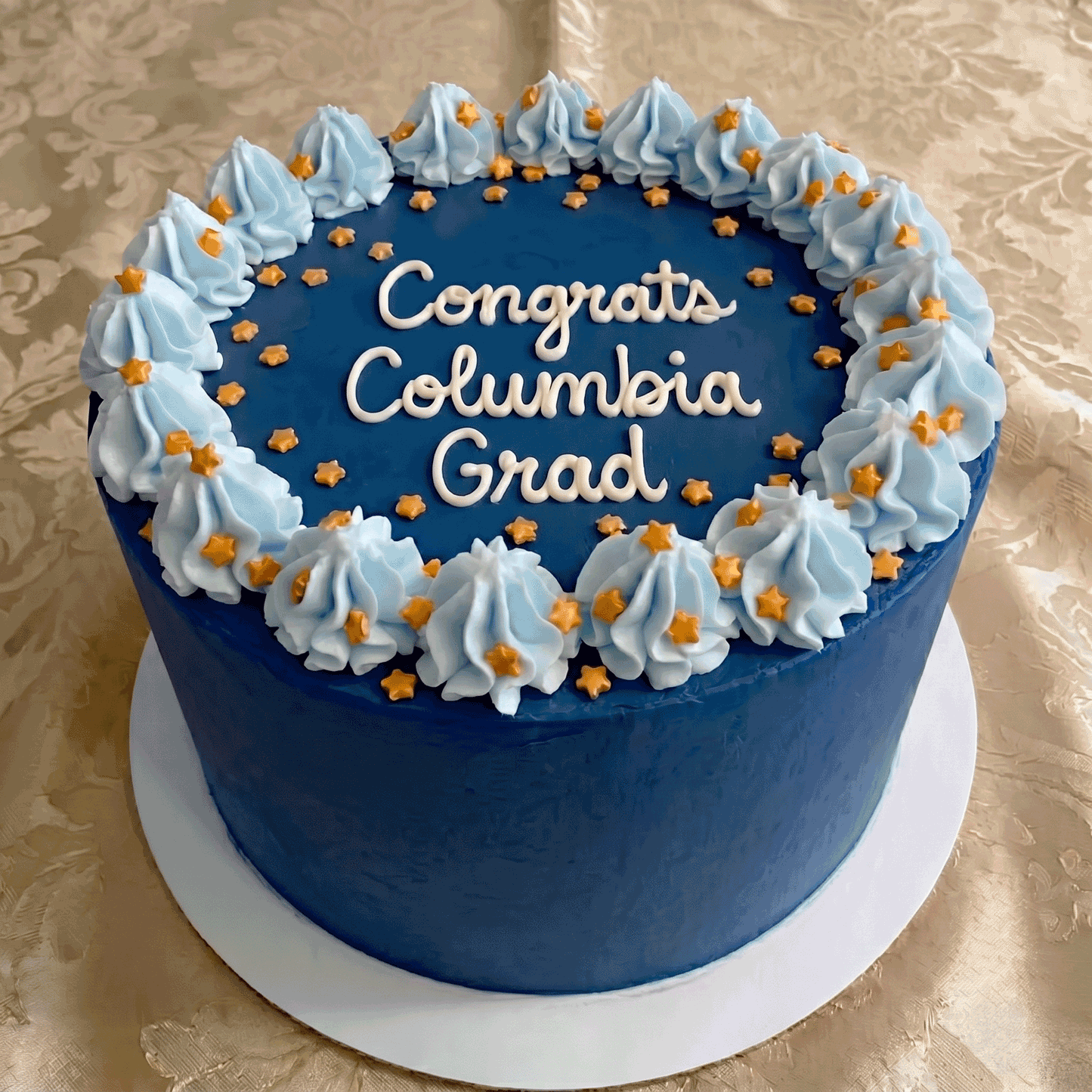 Columbia themed buttercream graduation cake.